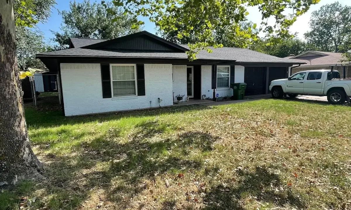 Professional roofing crew working on a residential roof in Champion Heights
